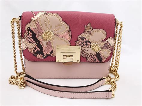 michael kors flower black clutches|Michael Kors pink flower purse.